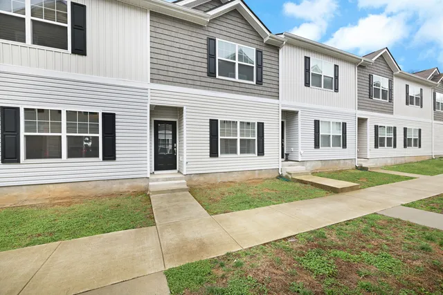 a house with yard in front of it