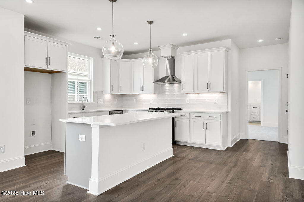5209 Moonshell Loop Wilmington, NC 28412 - Photo 13 of 37 Kitchen with Quartz Countertops, Stainless Steel Gas Range, Vent hood, dishwasher and microwave.