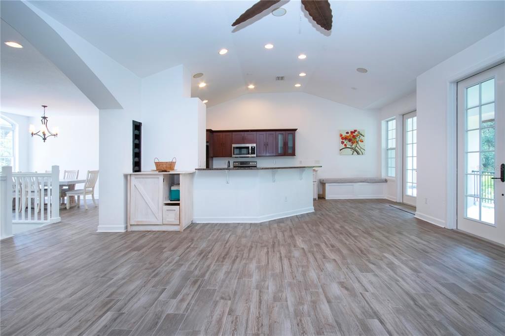 1422 Lightfoot Road Wimauma, FL 33598 - Photo 24 of 98 a view of kitchen with cabinets and wooden floor