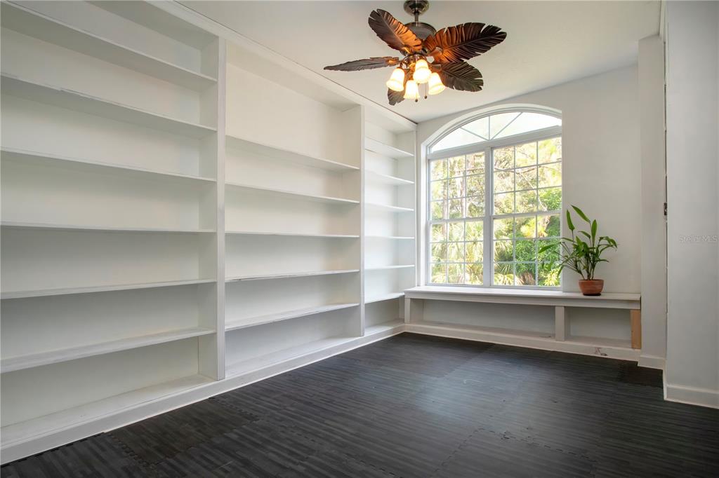 1422 Lightfoot Road Wimauma, FL 33598 - Photo 28 of 98 a view of room with window and ceiling fan