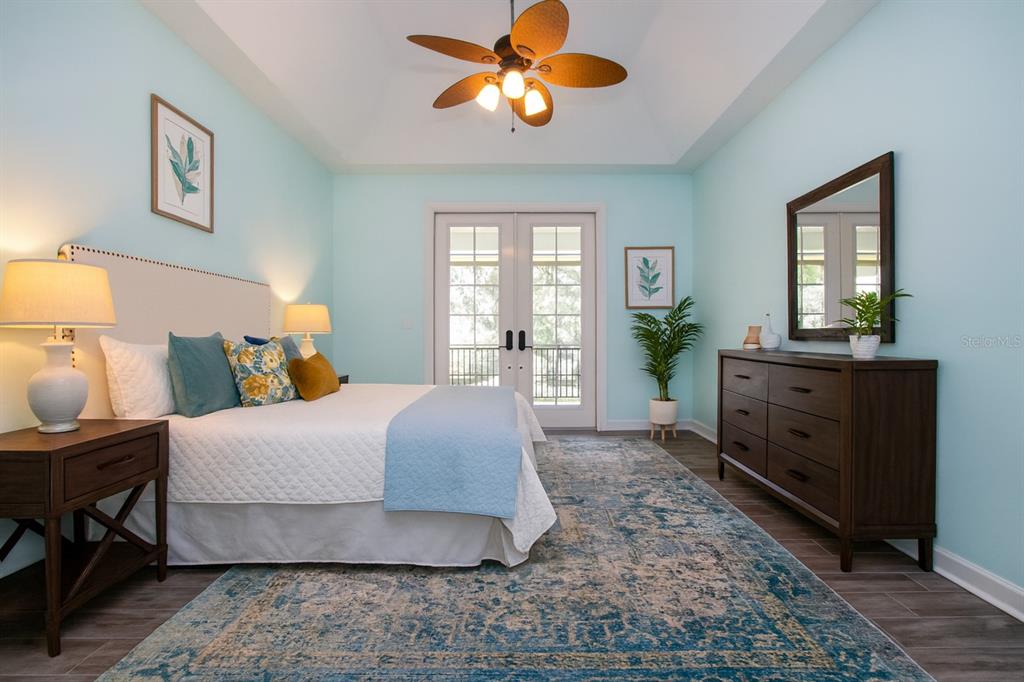 1422 Lightfoot Road Wimauma, FL 33598 - Photo 35 of 98 a bedroom with a bed and wooden floor