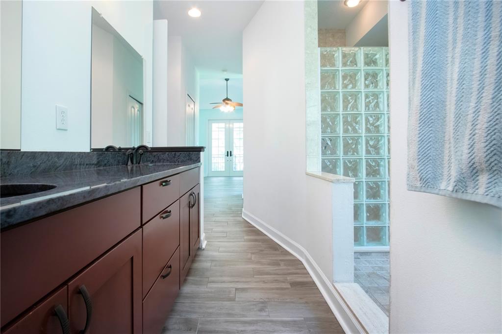 1422 Lightfoot Road Wimauma, FL 33598 - Photo 41 of 98 a kitchen with granite countertop a sink and a window
