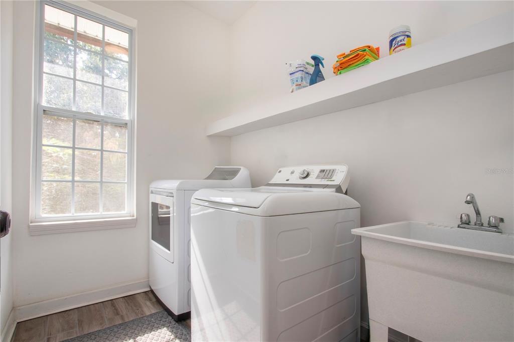 1422 Lightfoot Road Wimauma, FL 33598 - Photo 49 of 98 a utility room with dryer and washer