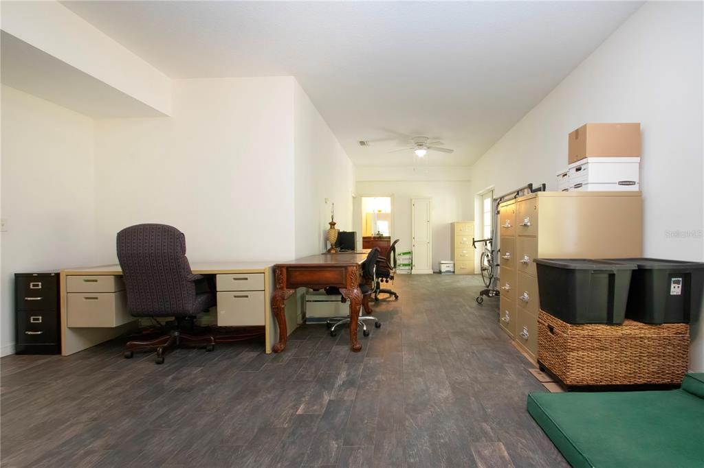 1422 Lightfoot Road Wimauma, FL 33598 - Photo 58 of 98 a view of a workspace with furniture and a window
