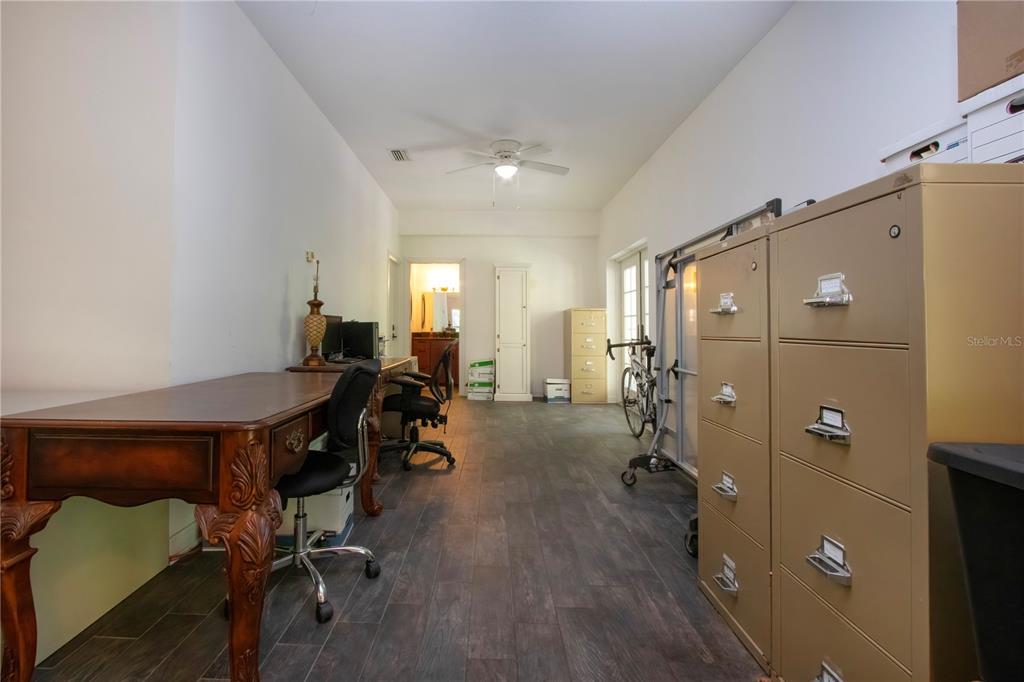 1422 Lightfoot Road Wimauma, FL 33598 - Photo 59 of 98 a view of a room with gym equipment