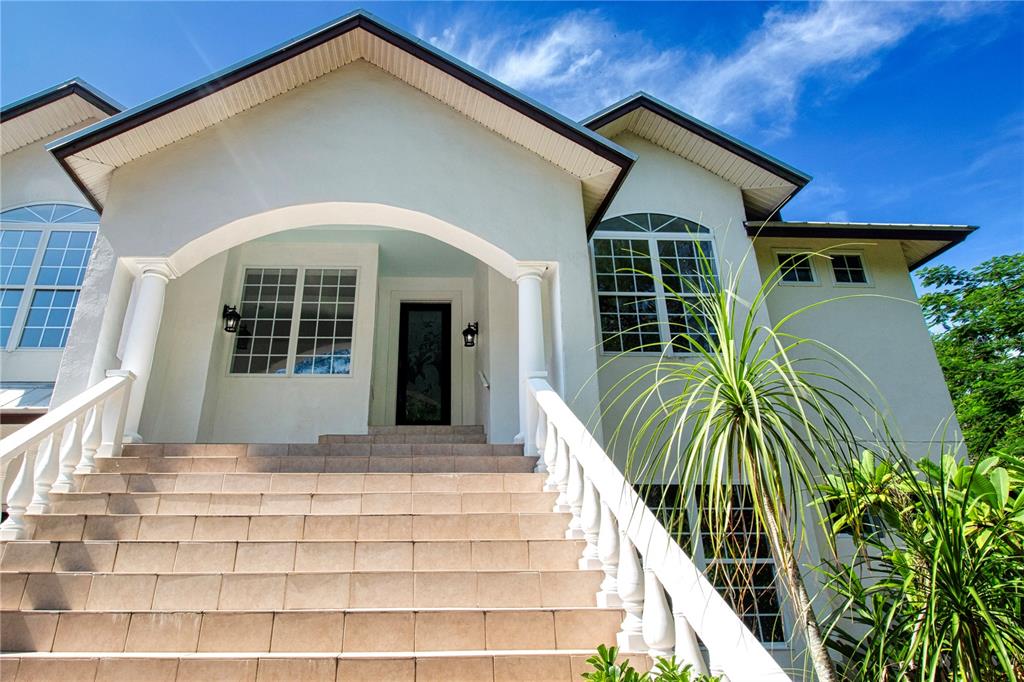 1422 Lightfoot Road Wimauma, FL 33598 - Photo 6 of 98 a front view of a house with a yard