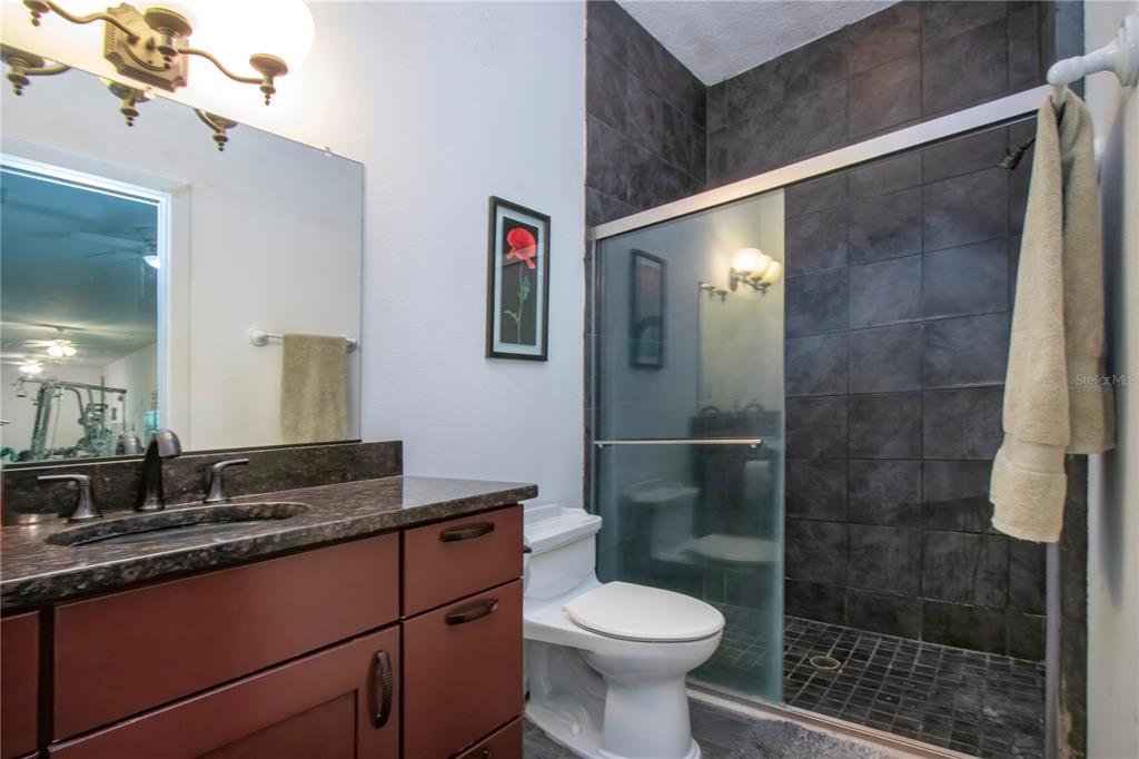 1422 Lightfoot Road Wimauma, FL 33598 - Photo 61 of 98 a bathroom with a sink and a mirror