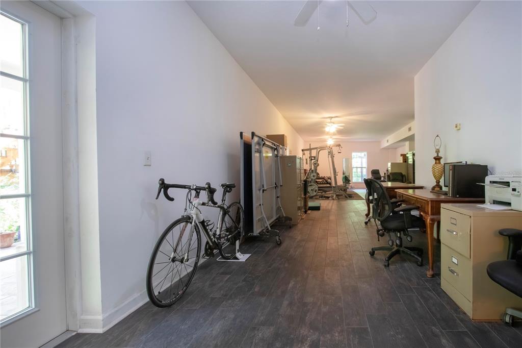 1422 Lightfoot Road Wimauma, FL 33598 - Photo 63 of 98 a view of a room with gym equipment