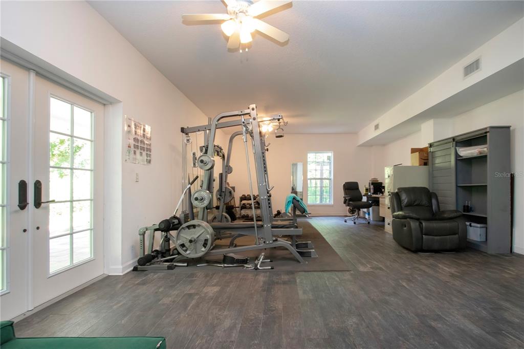 1422 Lightfoot Road Wimauma, FL 33598 - Photo 64 of 98 a view of a livingroom with furniture and a window