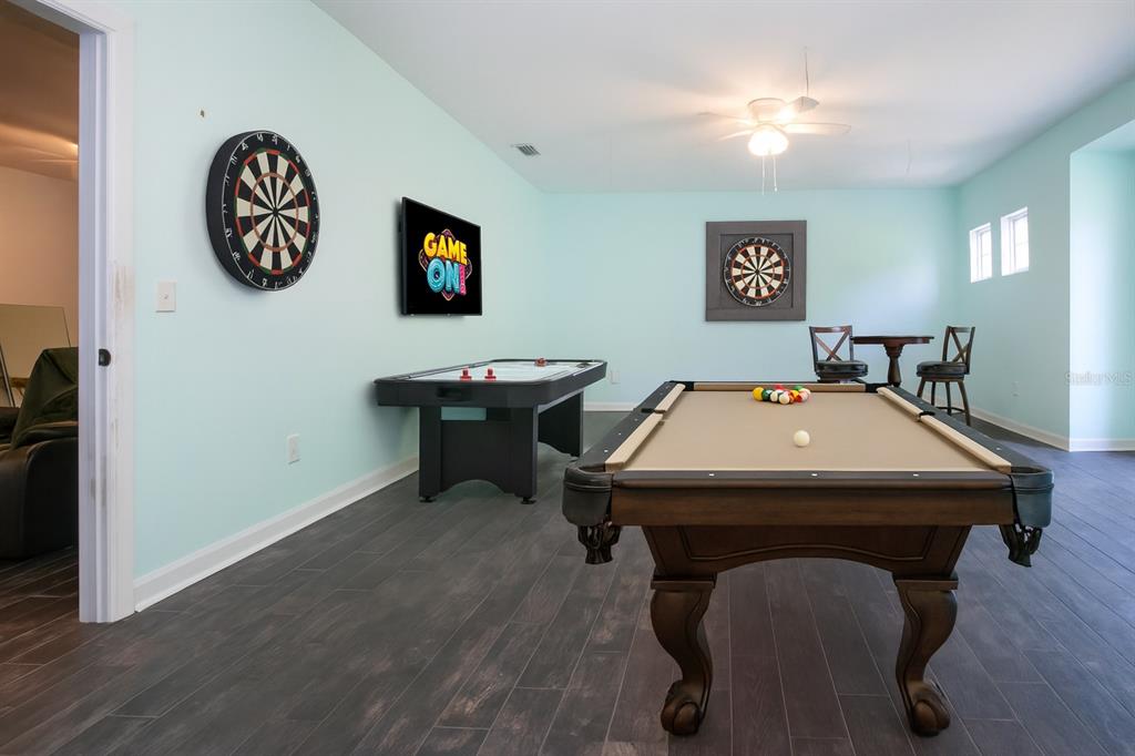 1422 Lightfoot Road Wimauma, FL 33598 - Photo 66 of 98 a room with a table chairs and a window