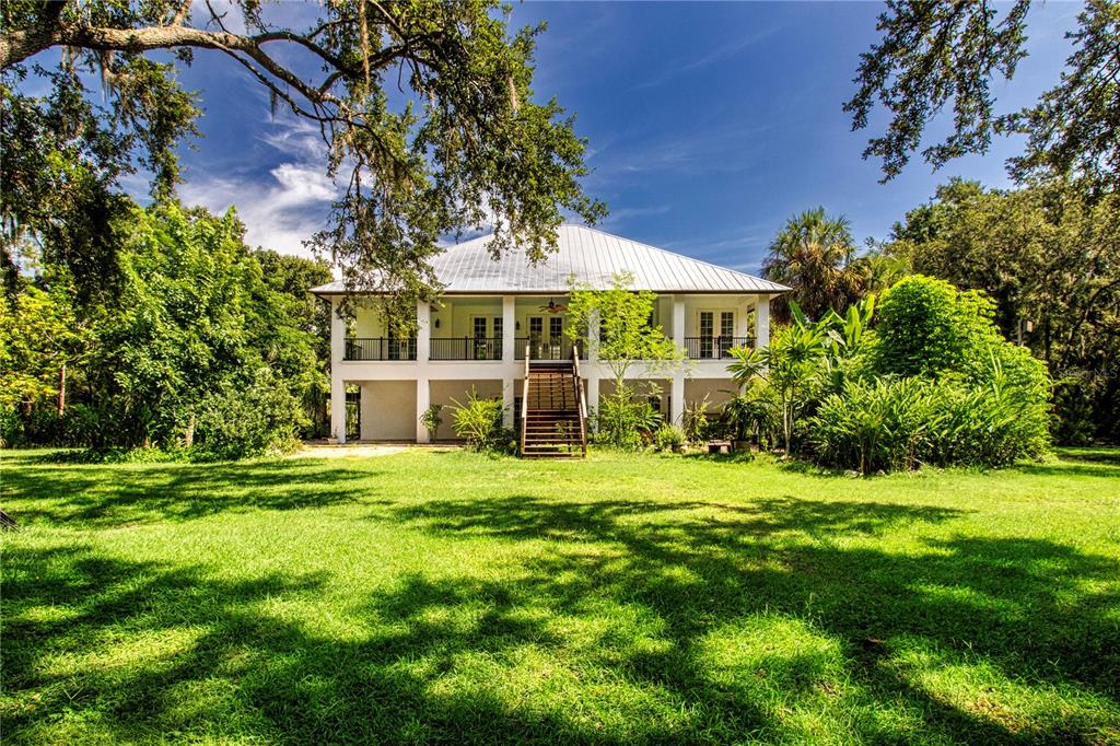 1422 Lightfoot Road Wimauma, FL 33598 - Photo 73 of 98 a front view of a house with a yard