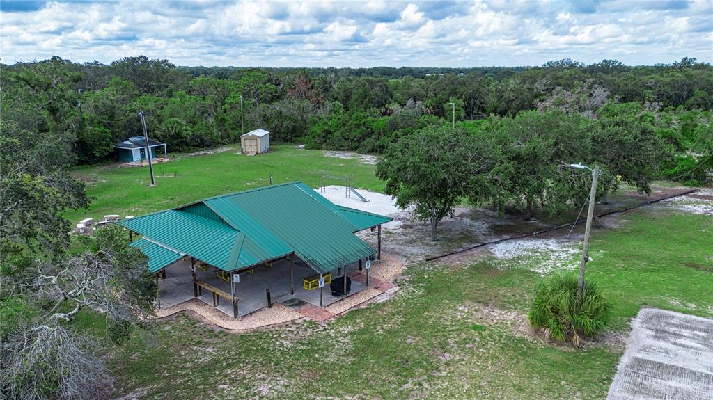 1422 Lightfoot Road Wimauma, FL 33598 - Photo 91 of 98 an aerial view of a house with a garden