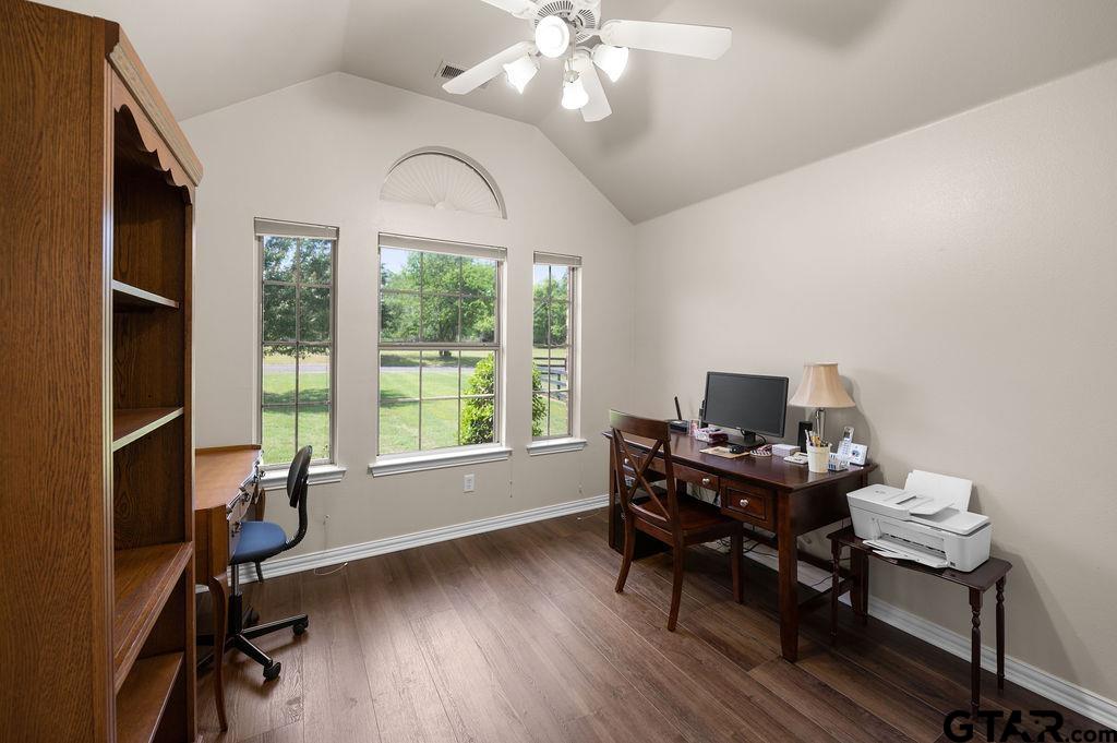 863 County Road 2950 Alba, TX 75410 - Photo 18 of 33 a view of a workspace with furniture and a window