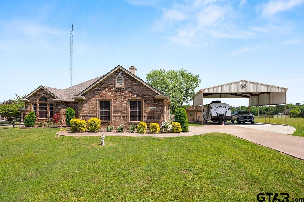 863 County Road 2950 Alba, TX 75410 - Photo 2 of 33 a front view of house with outdoor seating and yard