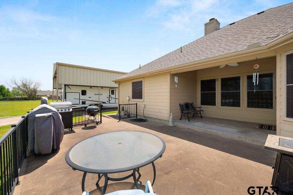 863 County Road 2950 Alba, TX 75410 - Photo 22 of 33 a swimming pool with outdoor seating and yard