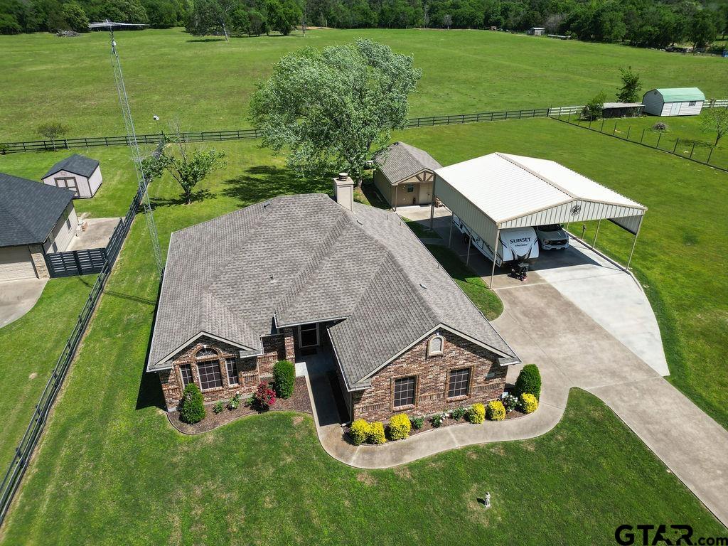 863 County Road 2950 Alba, TX 75410 - Photo 4 of 33 an aerial view of a house with swimming pool garden and a yard