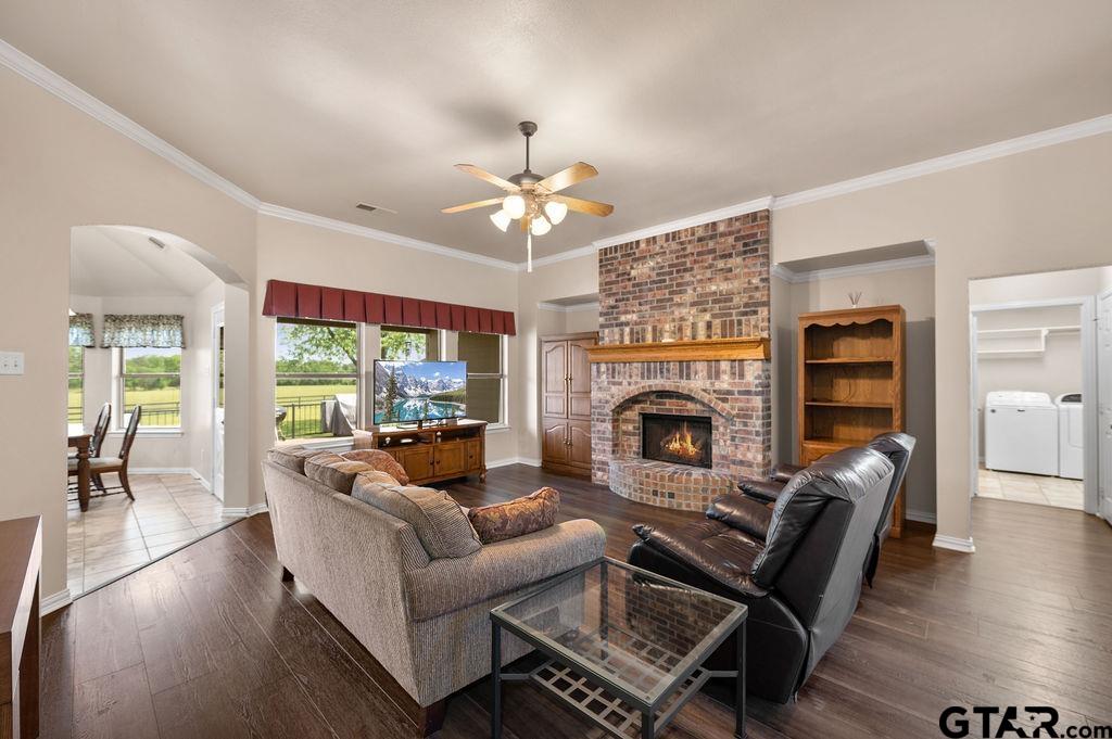863 County Road 2950 Alba, TX 75410 - Photo 7 of 33 a living room with furniture a fireplace and a chandelier