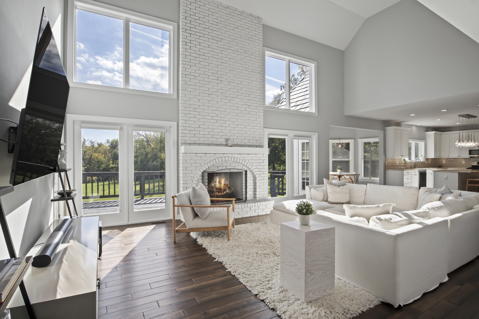 36W669 Crane Road St. Charles, IL 60174 - Photo 16 of 62 a living room with fireplace furniture and a flat screen tv