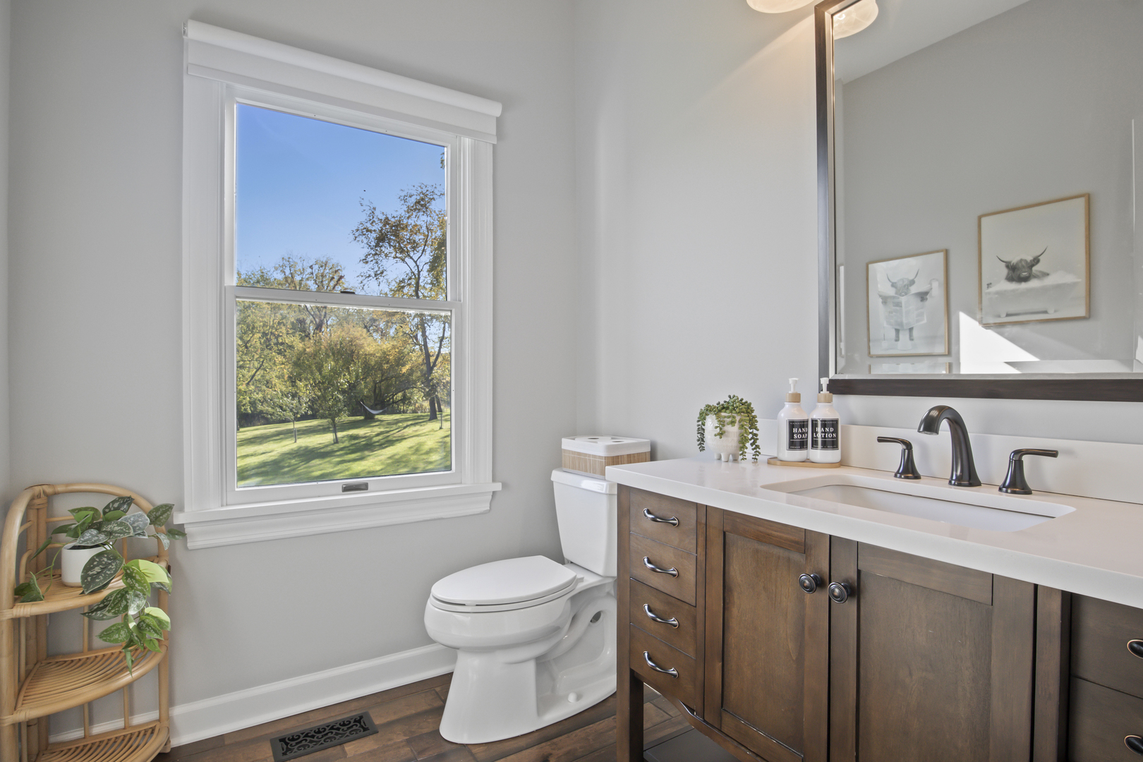 36W669 Crane Road St. Charles, IL 60174 - Photo 21 of 62 a bathroom with a granite countertop toilet a sink a mirror and a window