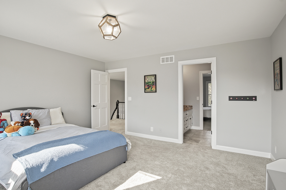 36W669 Crane Road St. Charles, IL 60174 - Photo 36 of 62 a bedroom with a bed and a chandelier
