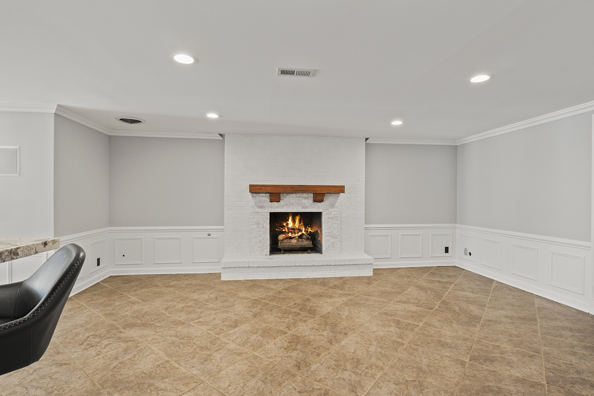 36W669 Crane Road St. Charles, IL 60174 - Photo 44 of 62 a view of an empty room with a fireplace and a window