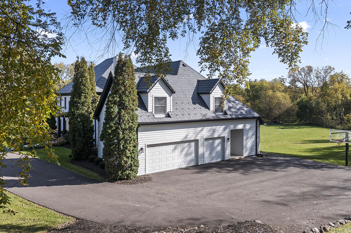 36W669 Crane Road St. Charles, IL 60174 - Photo 56 of 62 a front view of a house with a yard and garage