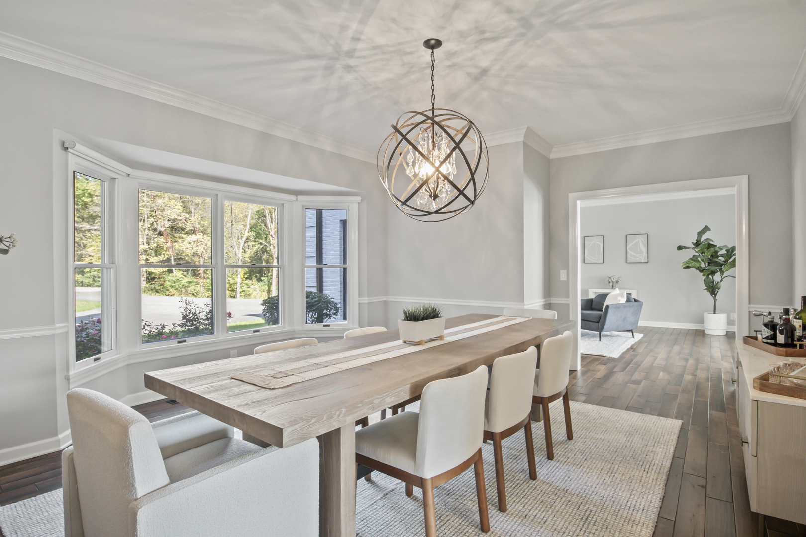 36W669 Crane Road St. Charles, IL 60174 - Photo 8 of 62 a view of a dining room and livingroom with furniture wooden floor a chandelier