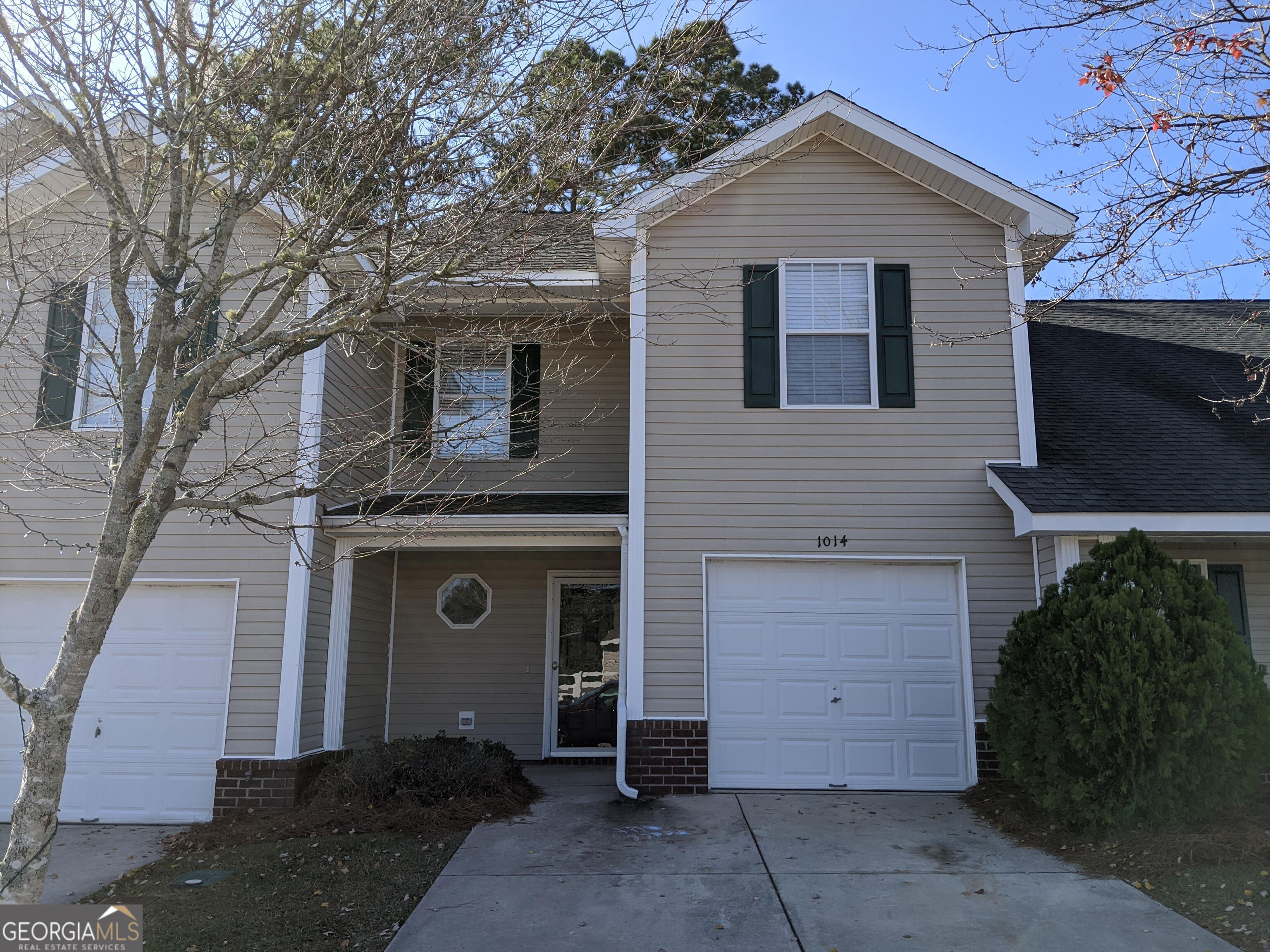 1014 Towne Park Drive East Rincon, GA 31326 - Photo 1 of 21 a front view of a house with a yard