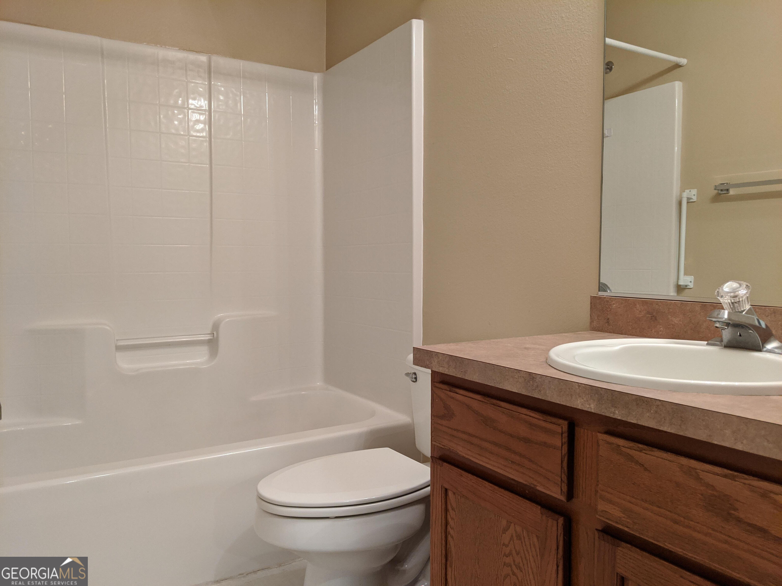 1014 Towne Park Drive East Rincon, GA 31326 - Photo 21 of 21 a bathroom with a granite countertop sink toilet and a mirror