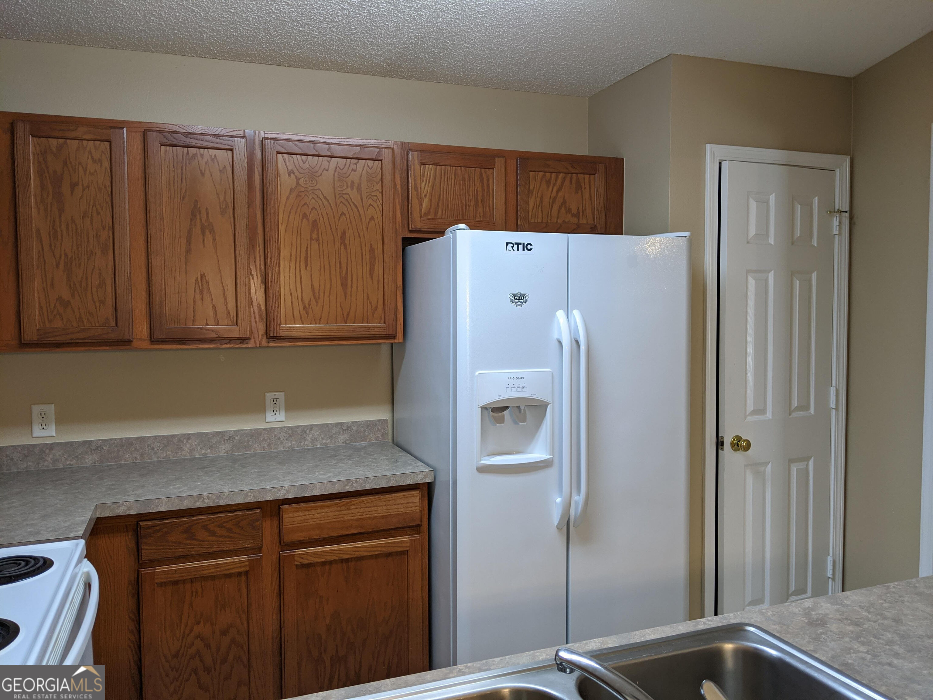 1014 Towne Park Drive East Rincon, GA 31326 - Photo 10 of 21 a white refrigerator freezer sitting inside of a kitchen