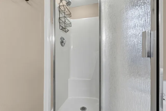 a view of a balcony with floor to ceiling windows