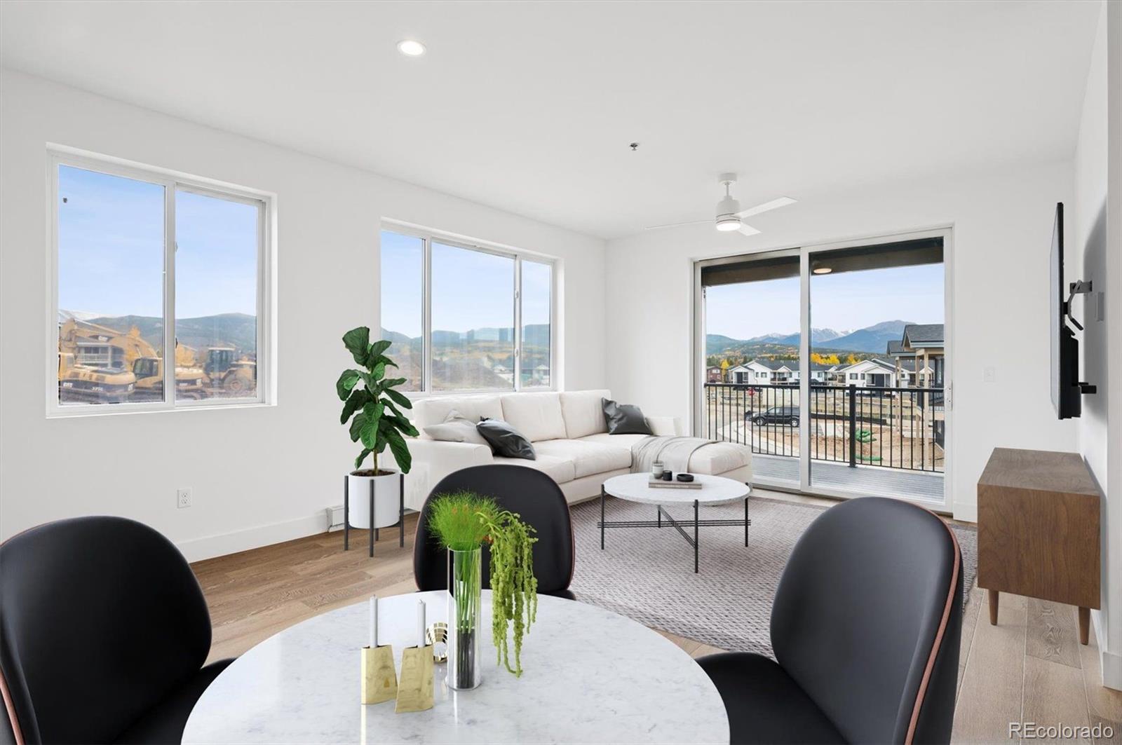 a living room with furniture lamp and window