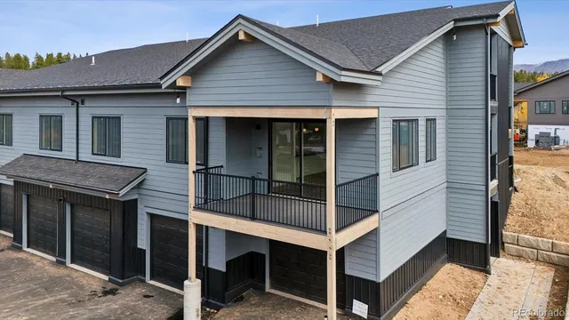 a view of house that has a car park front door