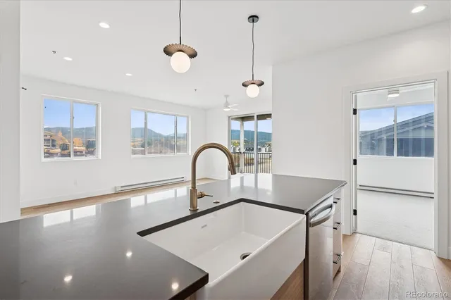 a kitchen with a sink a counter top space and a window