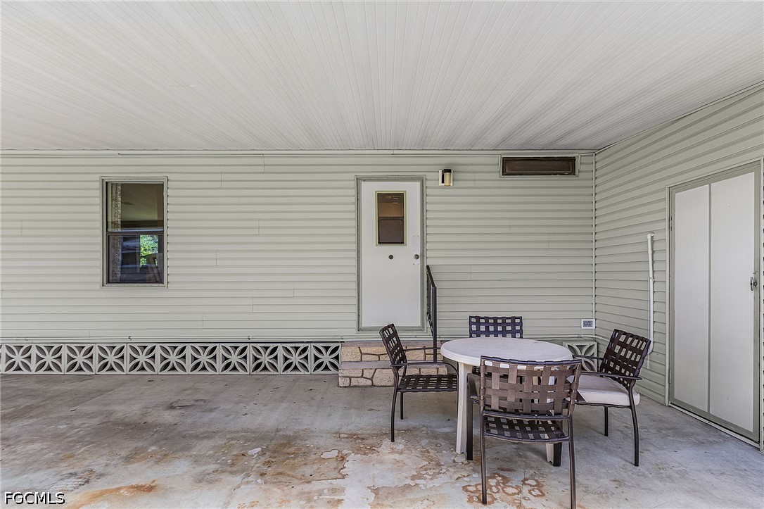 5 Erica Street Alva, FL 33920 - Photo 27 of 37 a view of a house with backyard and sitting area