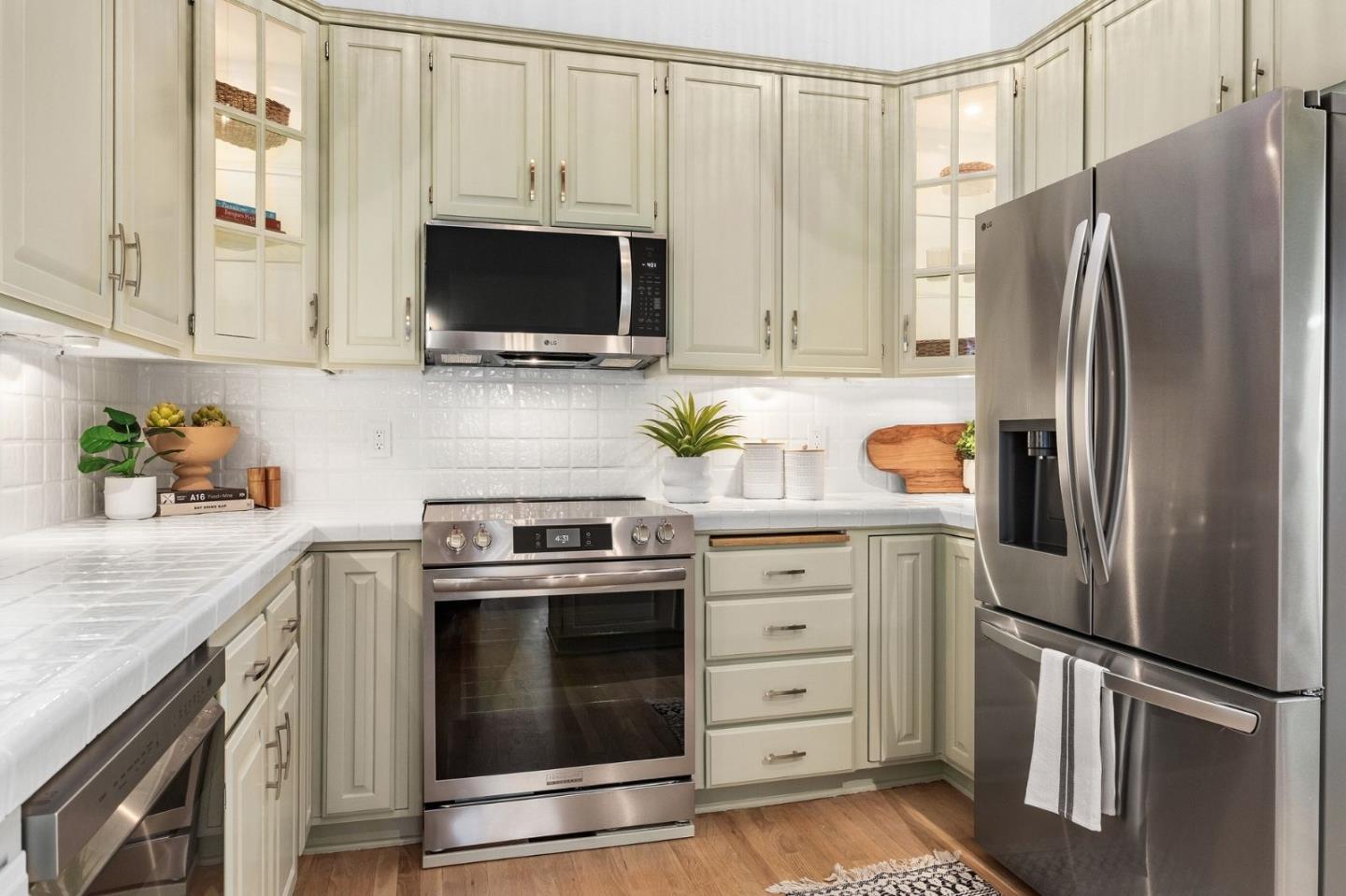 231 Nelson Road Scotts Valley, CA 95066 - Photo 16 of 54 a kitchen with stainless steel appliances a stove microwave and refrigerator