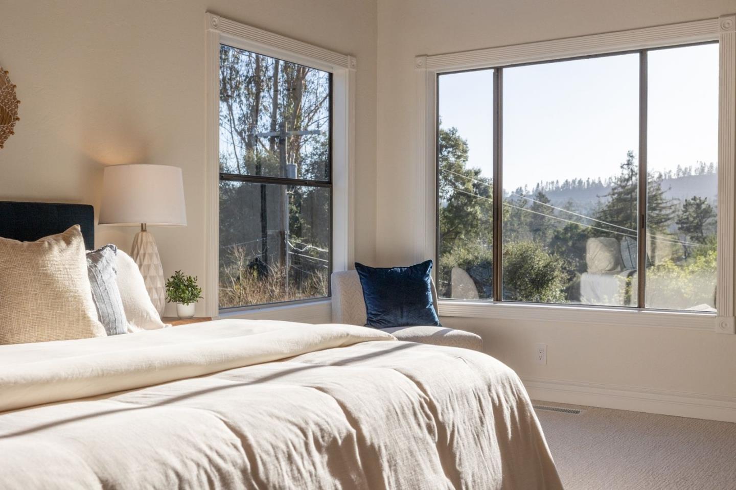 231 Nelson Road Scotts Valley, CA 95066 - Photo 21 of 54 a bedroom with a large bed and a large window
