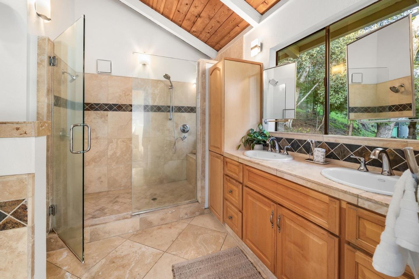 231 Nelson Road Scotts Valley, CA 95066 - Photo 24 of 54 a bathroom with a shower sink and mirror