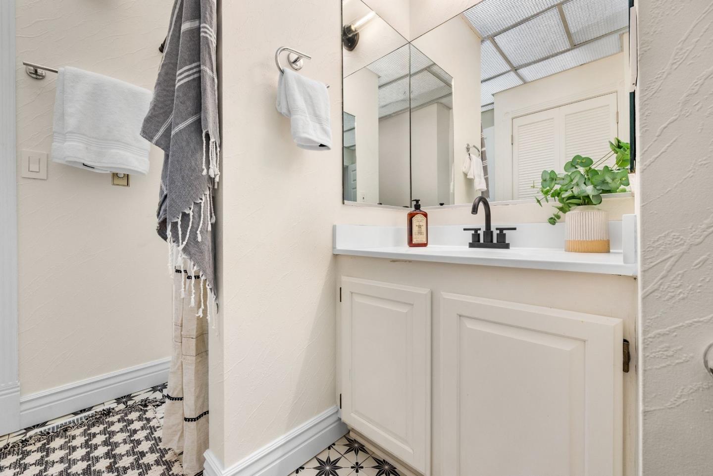 231 Nelson Road Scotts Valley, CA 95066 - Photo 30 of 54 a bathroom with a sink and a mirror