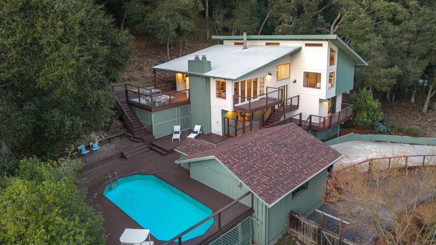 231 Nelson Road Scotts Valley, CA 95066 - Photo 3 of 54 an aerial view of a house with swimming pool and yard