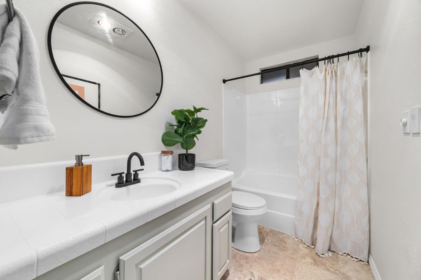 231 Nelson Road Scotts Valley, CA 95066 - Photo 34 of 54 a bathroom with a sink a mirror a toilet and a mirror