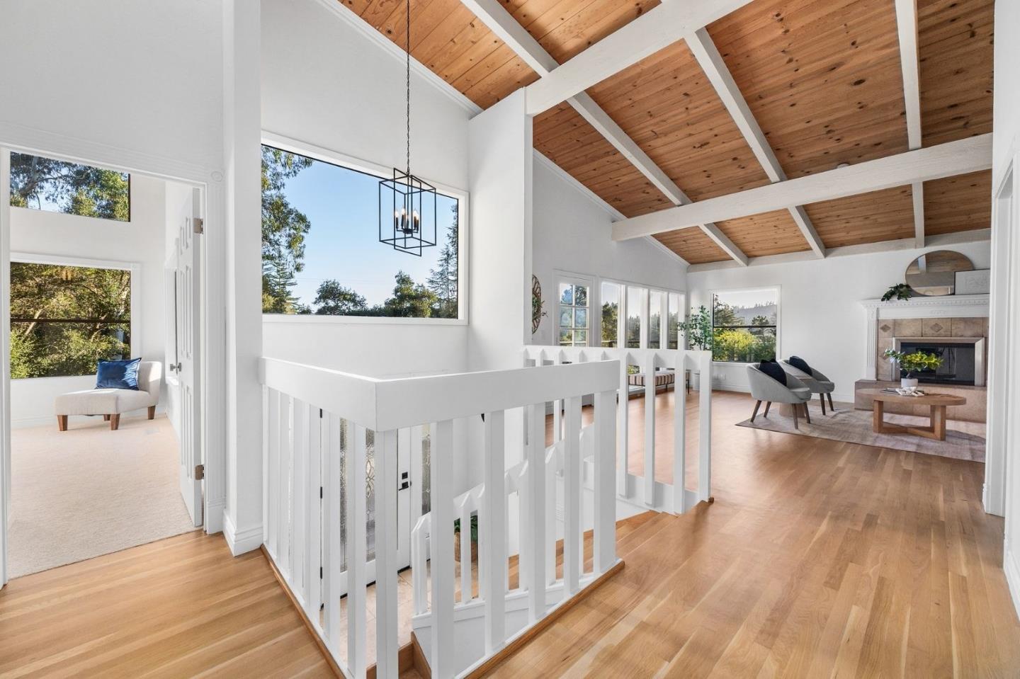231 Nelson Road Scotts Valley, CA 95066 - Photo 7 of 54 a view of a hallway with wooden floor and furniture