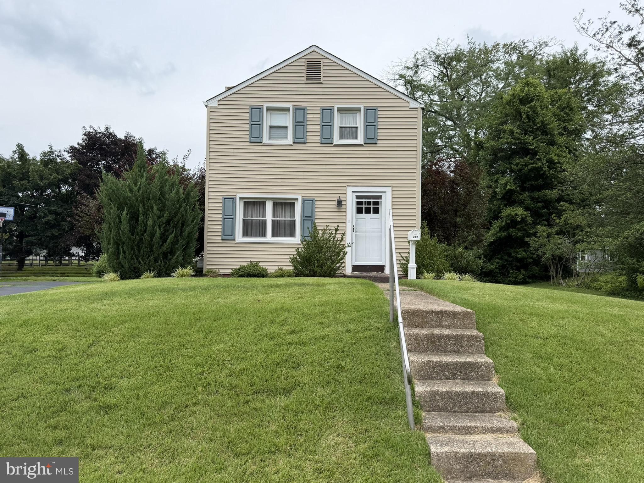 217 Lyster Road Oreland, PA 19075 - Photo 2 of 11 Charming home with lush green lawn.