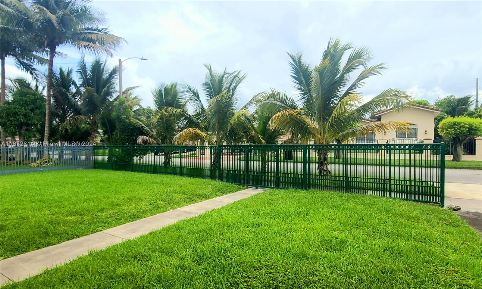 125 Northeast 193rd Street Miami, FL 33179 - Photo 2 of 20 a view of a park and palm trees