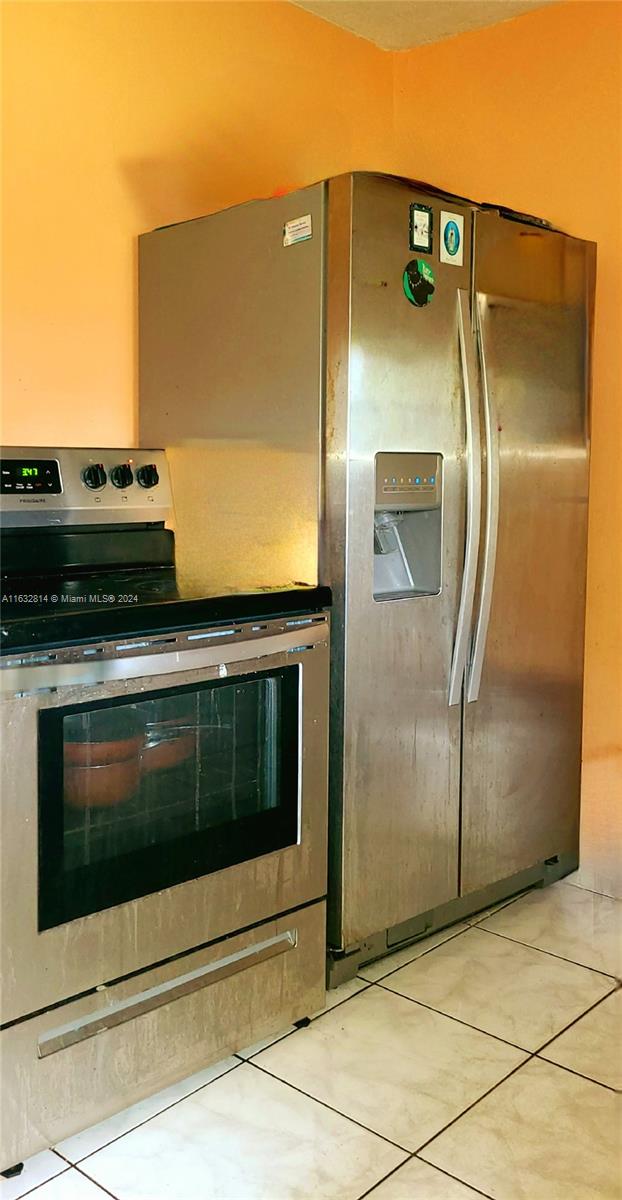 125 Northeast 193rd Street Miami, FL 33179 - Photo 9 of 20 a view of a refrigerator in kitchen