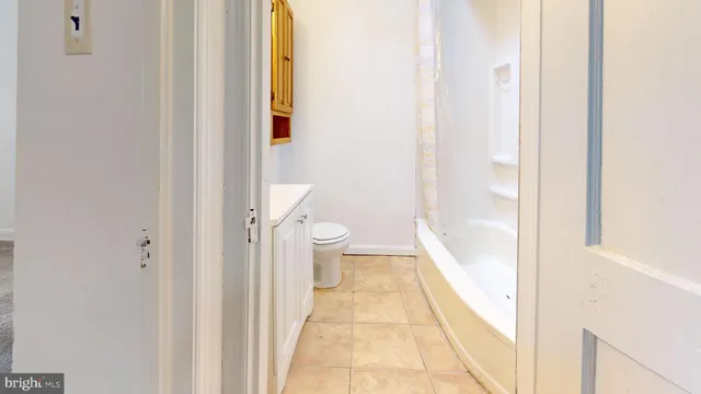 a bathroom with a vanity and a toilet