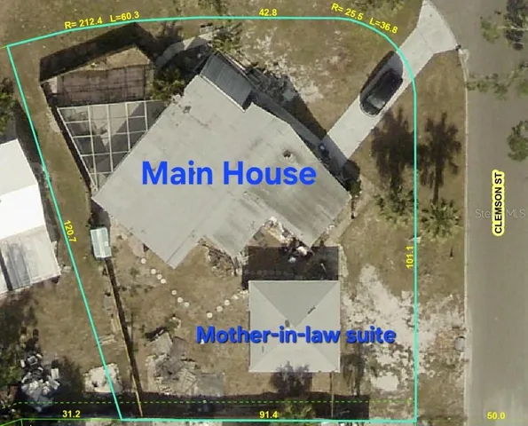 a large kitchen with stainless steel appliances kitchen island granite countertop a sink and a stove top oven with wooden floor