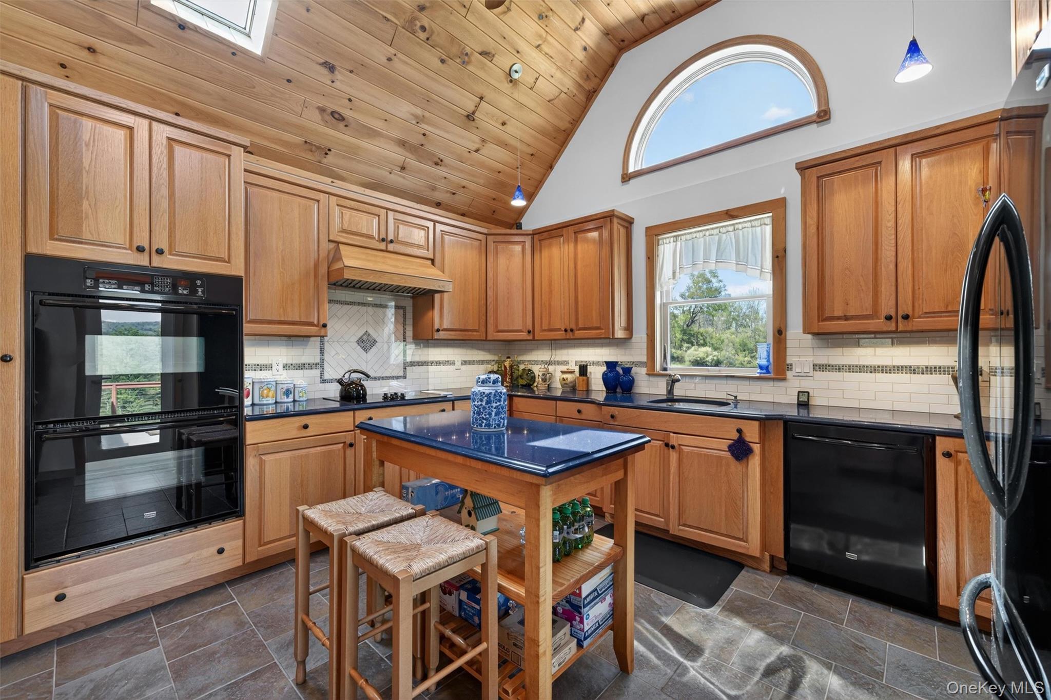 340 Hospital Road Callicoon, NY 12723 - Photo 8 of 41 a kitchen with stainless steel appliances granite countertop a stove a sink dishwasher and a refrigerator