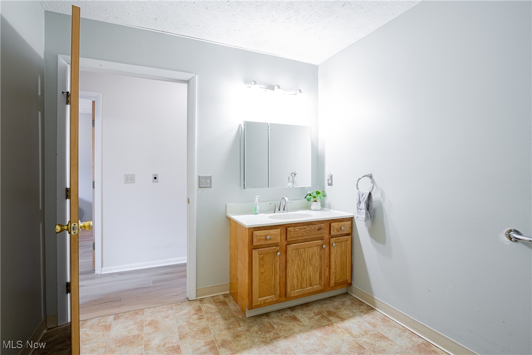 2643 Graham Road Stow, OH 44224 - Photo 9 of 30 Bathroom featuring vanity and a textured ceiling