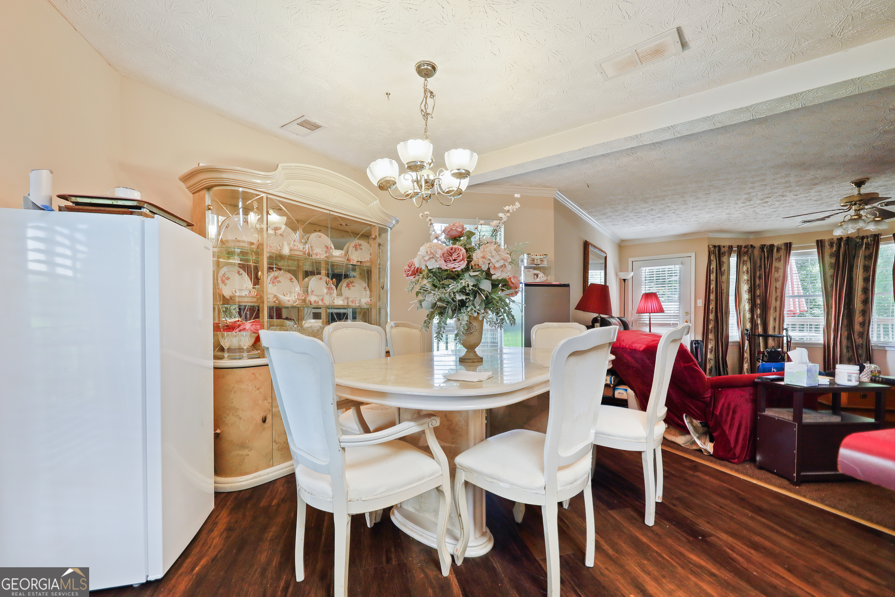 2433 Bear Creek Road Statham, GA 30666 - Photo 14 of 58 a view of a dining room with furniture and wooden floor